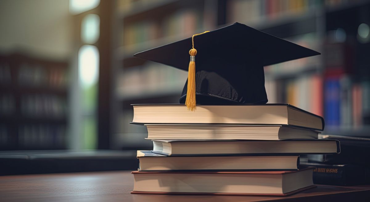 Mortarboard sitting on books